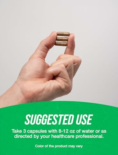 Hand holding three capsules with suggested use instructions.